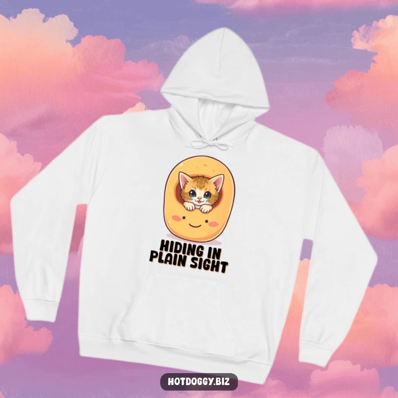 Funny curious kitten peeking from a smiling hot dog bun, printed on a cozy hoodie.